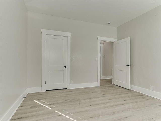 spare room featuring light hardwood / wood-style floors