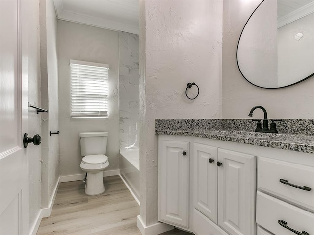 full bathroom featuring hardwood / wood-style floors, vanity, toilet, and ornamental molding