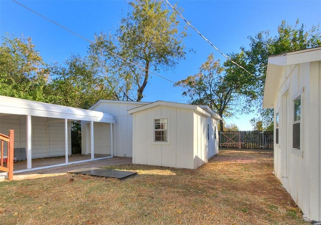 view of home's exterior with an outdoor structure