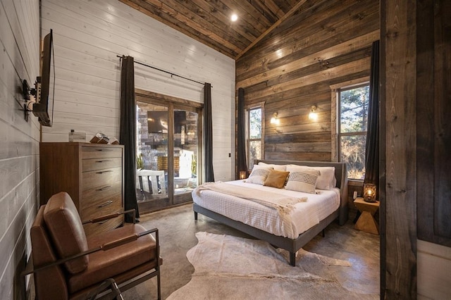 bedroom featuring wood ceiling, high vaulted ceiling, and concrete flooring