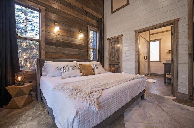 bedroom featuring wood walls