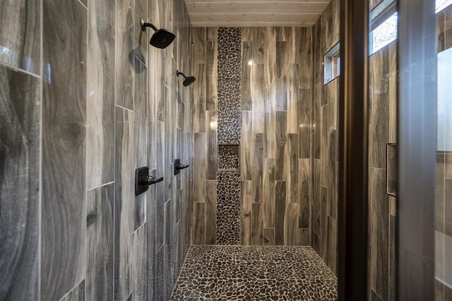 bathroom with tiled shower