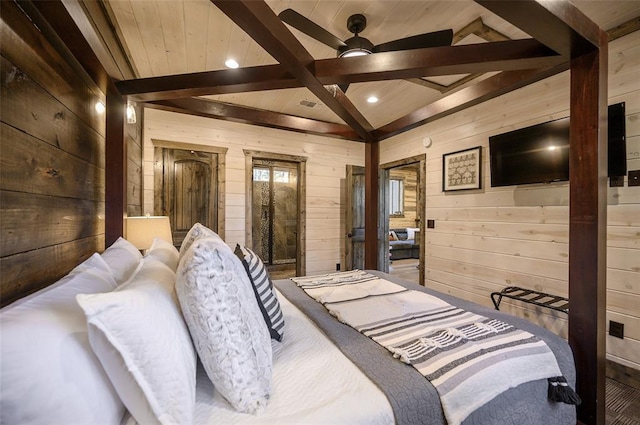 bedroom with hardwood / wood-style floors, vaulted ceiling with beams, ceiling fan, and wooden walls