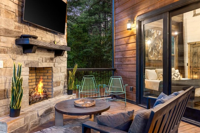 view of patio / terrace with an outdoor stone fireplace