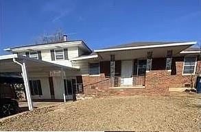 125 W Coe Dr, Midwest City, OK 73110 - view of front of property with a carport and covered porch