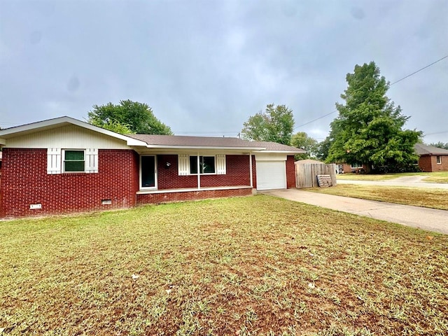 ranch-style house with a front yard and a garage