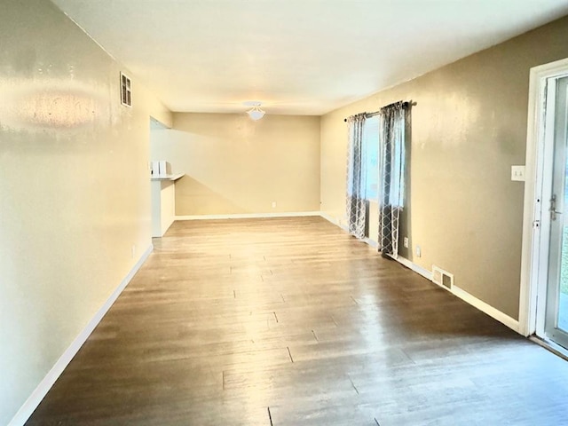 spare room with hardwood / wood-style flooring