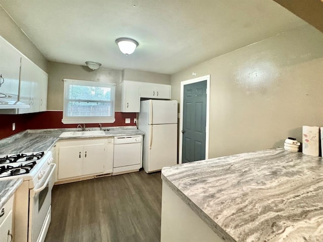 kitchen with sink, white cabinets, dark hardwood / wood-style floors, and white appliances