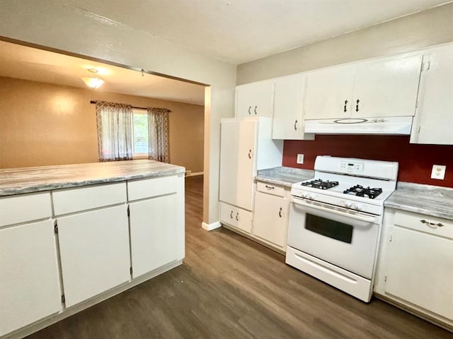 kitchen featuring white gas range, white cabinetry, and dark hardwood / wood-style floors