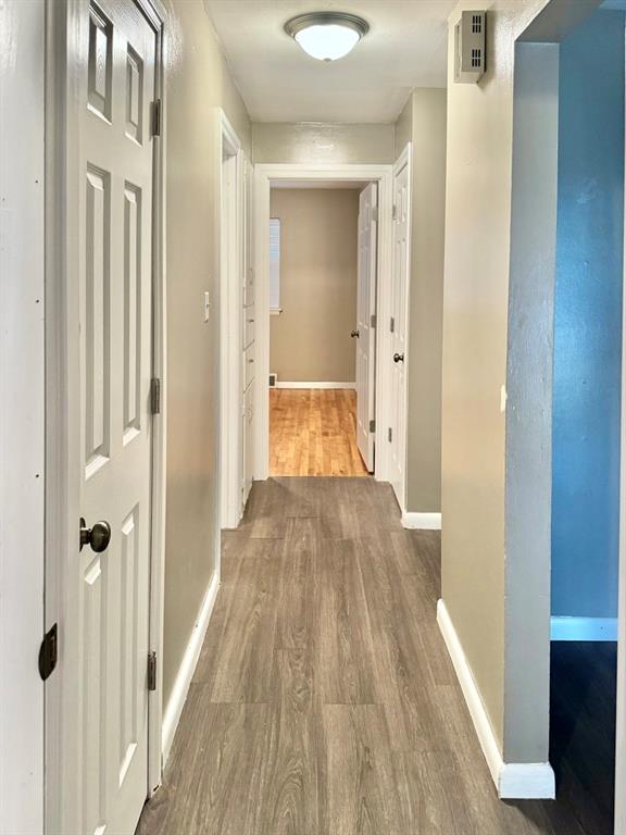 hall featuring wood-type flooring