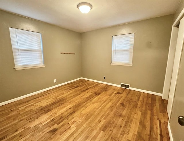 unfurnished room featuring wood-type flooring