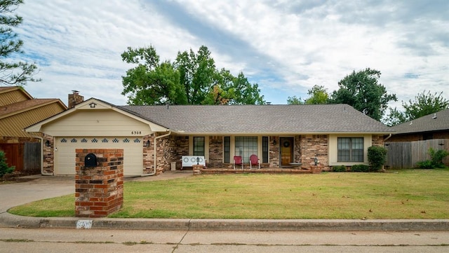 ranch-style house with a porch, a front yard, and a garage