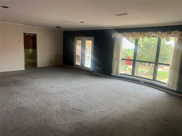 carpeted spare room with crown molding