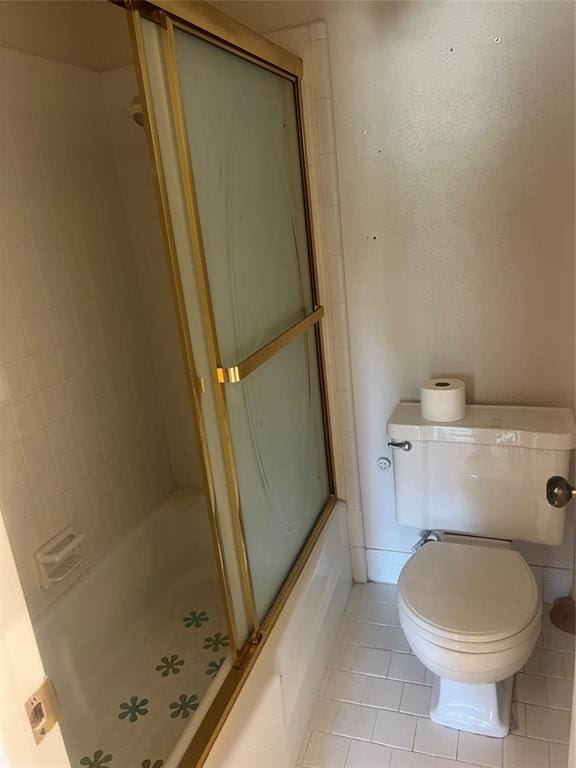 bathroom with tile patterned flooring and toilet