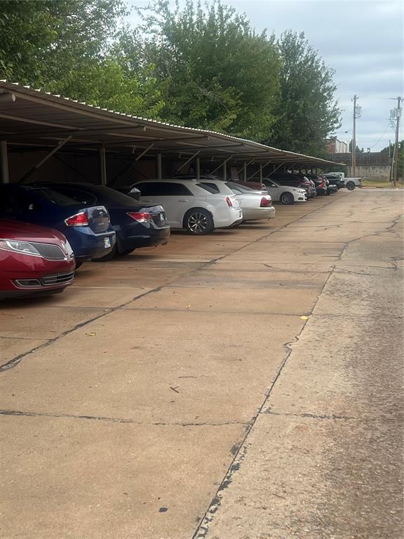 view of parking featuring a carport