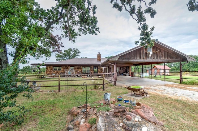 view of property's community featuring an outbuilding