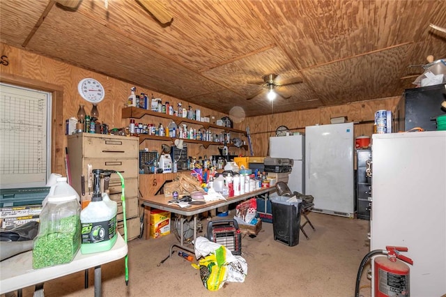 miscellaneous room featuring a workshop area, ceiling fan, wood ceiling, and wooden walls