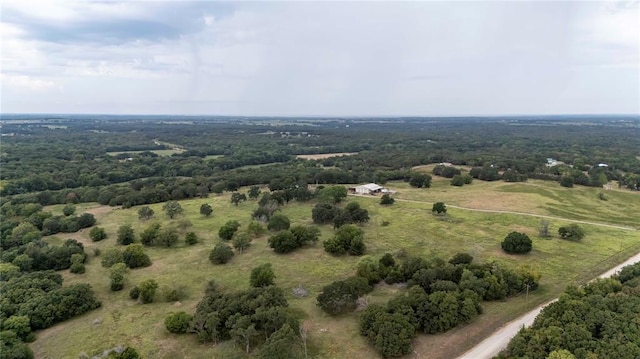 birds eye view of property with a rural view