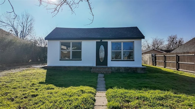 bungalow with a front yard