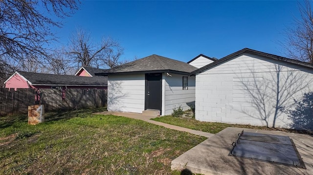 view of outbuilding with a lawn