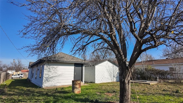 view of side of property with a yard