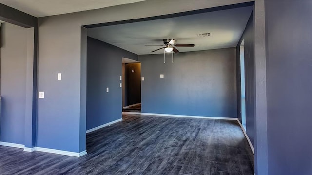 spare room featuring ceiling fan and dark hardwood / wood-style flooring