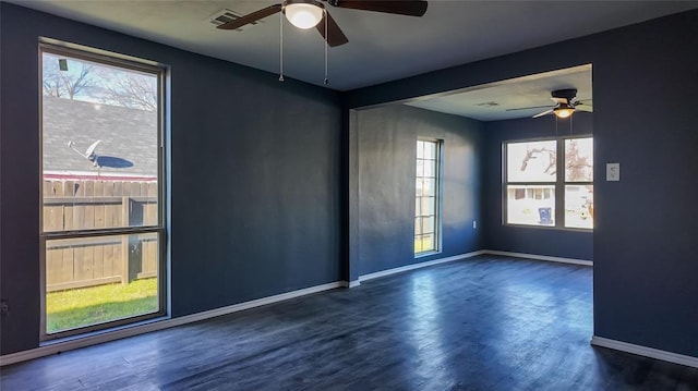 empty room with dark hardwood / wood-style flooring