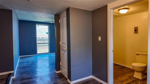 hallway with dark hardwood / wood-style floors