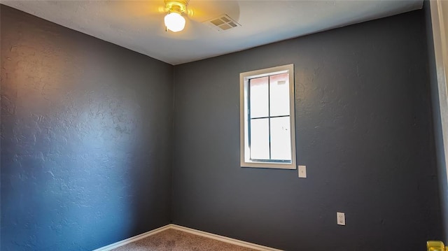 unfurnished room featuring carpet flooring and ceiling fan