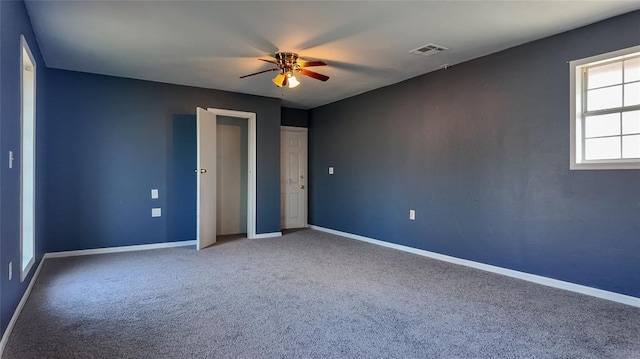 unfurnished bedroom featuring carpet and ceiling fan