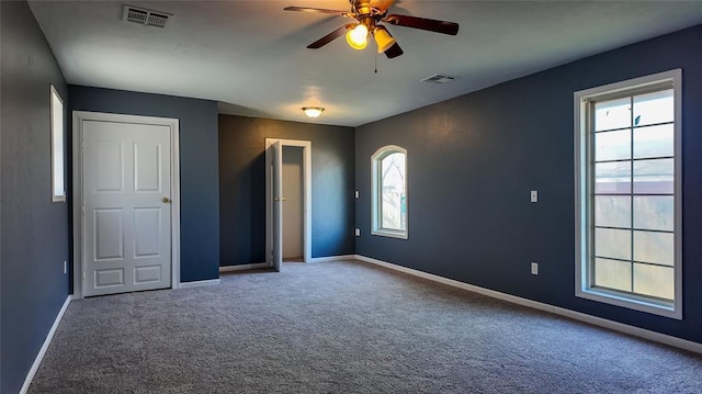 unfurnished bedroom featuring carpet flooring and ceiling fan