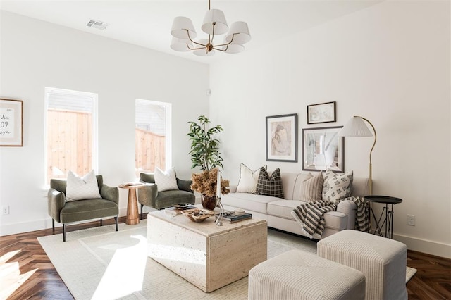 living room with parquet floors and a chandelier