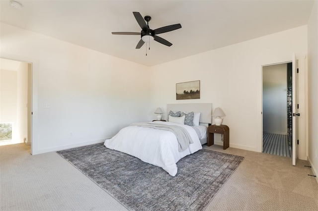 bedroom featuring light colored carpet and ceiling fan