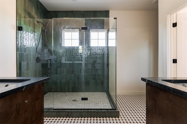 bathroom with vanity and a shower with shower door