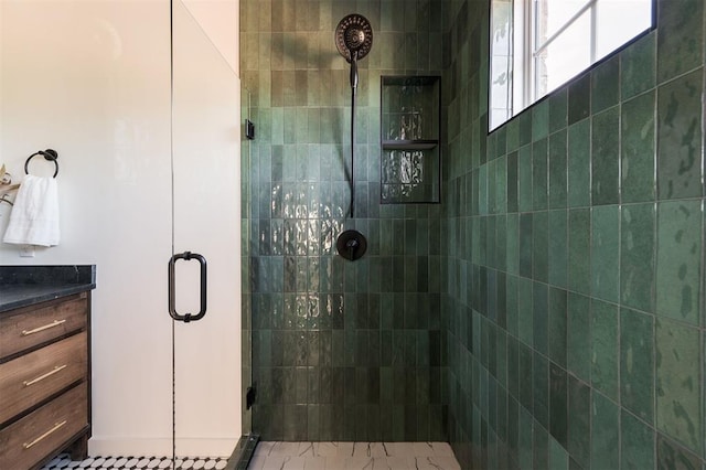 bathroom with vanity and walk in shower