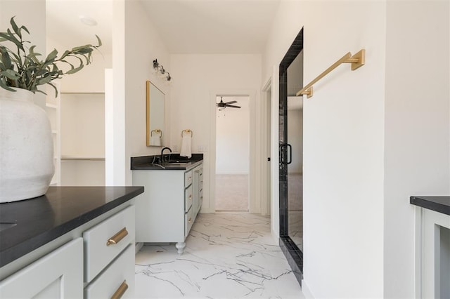 interior space with ceiling fan and vanity