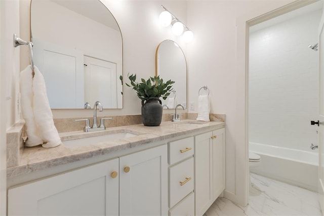 bathroom featuring bathing tub / shower combination and vanity