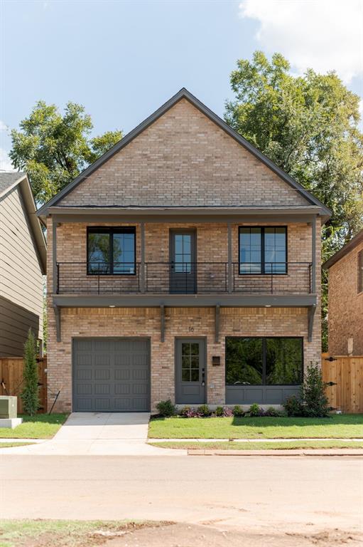 view of front of house featuring a balcony and a garage