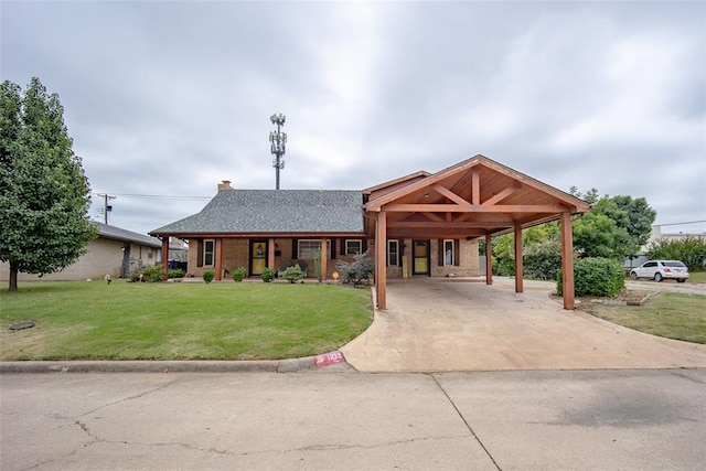 view of front of property featuring a carport and a front lawn