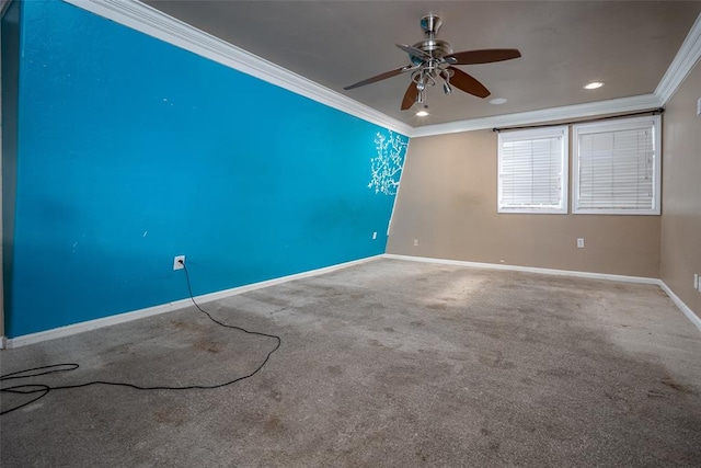 spare room featuring carpet, ceiling fan, and ornamental molding