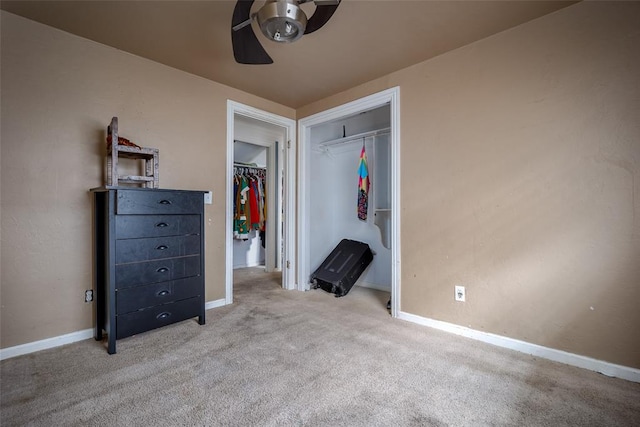 unfurnished bedroom with light colored carpet, a closet, and ceiling fan