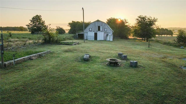 yard at dusk with an outdoor structure