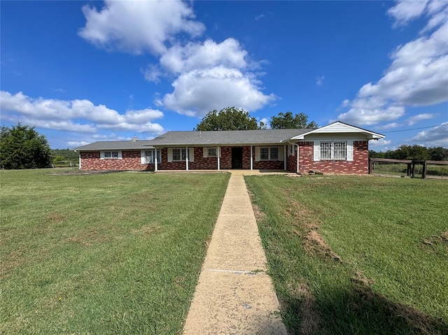 ranch-style home with a front yard