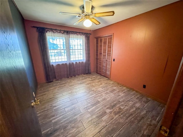 1345 State Highway 1, Hartshorne, OK 74547 - spare room featuring wood finished floors and ceiling fan