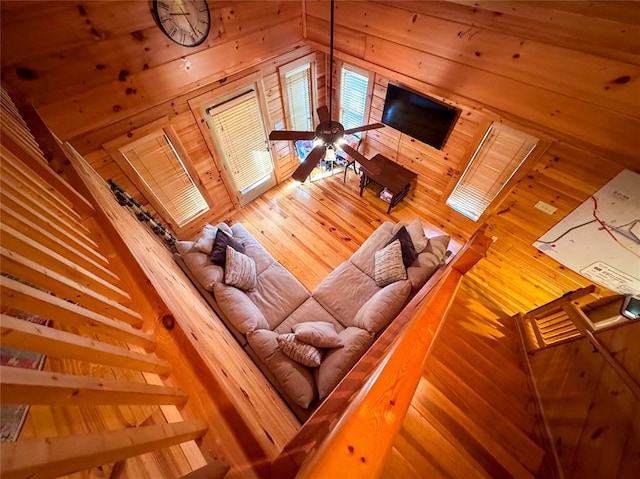 1345 State Highway 1, Hartshorne, OK 74547 - living room with wooden walls, ceiling fan, wood-type flooring, and lofted ceiling