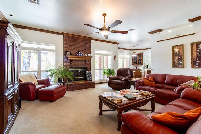 living room featuring crown molding, light colored carpet, a healthy amount of sunlight, and a brick fireplace