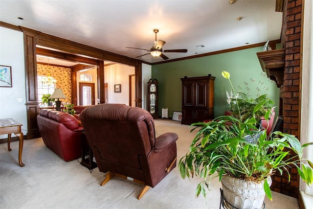 living room with ceiling fan, light colored carpet, and ornamental molding