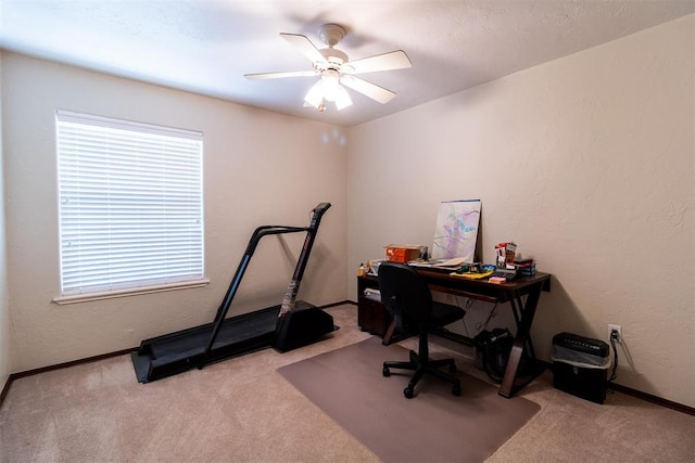 office area with light colored carpet and ceiling fan