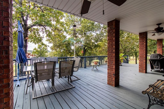 deck featuring a grill and ceiling fan