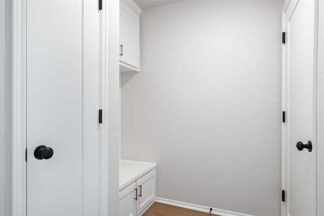 mudroom with dark wood-type flooring